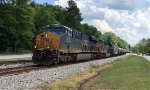 CSX 3045 and 986 lead a line of tank cars